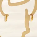 Detailed view of 18K gold plated hoop earrings with white enamel on an artistic stand - 3*11mm / White