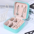 Portable mint green jewelry travel case with soft pink velvet interior and zipper - Lake Blue