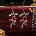 Colorful pear-cut gemstone drop earrings with gold plating and rhinestones on red velvet - Exaggerated Long Festive Christmas Earrings