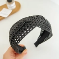 Detailed view of black woven wide headband with anti-slip liner and straw-like texture - Black