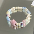 Ceramic beaded bracelet with pink starfish and blue leaf charms on mirror background - Xinghai (1007-08星海)