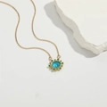 Collar de oro con piedra de nacimiento azul ovalada y halo de cristales verdes - Azul