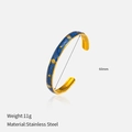 Detail shot of blue enamel star bangle in 18K gold plated stainless steel, 60mm diameter - Blue