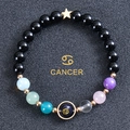 Bracciale segno Cancro con perle di ossidiana e ciondolo a stella in oro lucido - Cancro (Cancer)