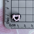 Detailed size measurement of black and pink heart resin charm on a metric scale mat - 06-Black Pink Heart Donut