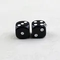 Pair of glossy black acrylic dice pendants with white dots and silver metal rings - Solid Black