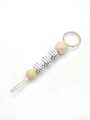 Sporty volleyball keychain with geometric wood beads and white volleyball pattern beads - Volleyball - Tassel Beaded Style