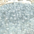 Macro shot of 10mm light blue and white cracked glass beads with ice texture for DIY jewelry - 8mm Semi-white Light Blue