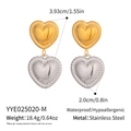 Detail shot of heart-shaped stainless steel earrings in gold and silver finish - Two-tone Gold and Silver (YYE025020-M)