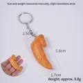 Realistic mini fried chicken wing keychain pendant with golden resin food texture - 5.8cm Braised Chicken Wing Tip - Keychain