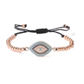 Detail of 18K gold plated Evil Eye bracelet featuring blue zirconia and polished metal beads - Rose Gold
