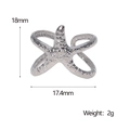 Detail of silver starfish ring with size dimensions 18mm by 17.4mm on white background - Starfish Shape / Steel