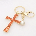 Detailed view of golden cross keychain with orange rhinestones and teardrop crystal - Orange Red-1