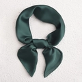 Deep green silk satin square scarf tied in a bow on a white textured background - Dark Green