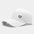 White cotton baseball cap with black heart embroidery on a neutral gray background - Adjustable / White