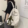 Close-up of beige canvas backpack featuring 'YOU ARE MY DESTINY' text and frog pendant - With Frog Pendant / Off-white