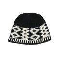 Detail view of winter knitted hat showing geometric jacquard pattern and ribbed hem - M (56-58cm) / Black