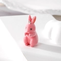Close-up of pink flocked rabbit pendant with silver metal ring for DIY jewelry making - Rabbit