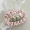 Close-up of handmade crochet flower hair clip with pink ruffled edges and floral embroidery - Crochet-Pink Flower Cluster
