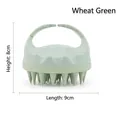 Detail view of wheat green silicone scalp massager brush showing ergonomic handle and bristles - Wheat Green