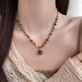 Bohemian beaded necklace with brown gemstone pendant on a model with lace top - Retro Irregular Frame Beaded Necklace (15# Necklace-Coffee)