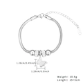 Detail of silver snake chain bracelet with butterfly charm and S.STEEL material mark - Butterfly Pendant / Silver