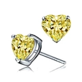 Macro shot of yellow heart-shaped zircon stud earrings with silver S925 hallmark detail - Yellow Zirconia