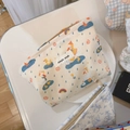 Macro shot of canvas pouch zipper and cute yellow duck print on white cotton fabric - Raindrop White Duck