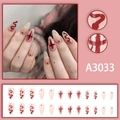 Almond-shaped press-on nails featuring snakes, crosses, and dark red patterns on nude base - A3033 Glue Style