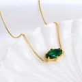 Golden box chain necklace with marquise green zircon pendant on white shell - Scorpio