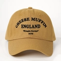 Detailed view of khaki cotton baseball cap featuring vintage Cheese Muffin embroidery - One Size / Turmeric