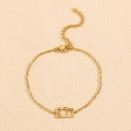 Detailed view of a gold stainless steel chain bracelet with a hollow camera pendant charms - 18K Gold Plated Camera Bracelet (N-878)
