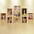 Modern minimalist light wood 8-frame wall set displayed on a warm textured wall with lighting - Raw Wood Grid / 7"