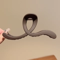 Matte dark brown twisted hair claw clip held by hand against a minimalist beige background - Matte Lines Dark Coffee-13cm