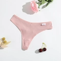 Pink ribbed cotton T-back thong with breathable texture on white background with floral decor - M / Dusty Pink