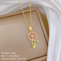 Detailed close-up of golden sunflower pendant with pink and green zircon crystals - Gold Sunflower Pendant