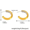 Detail view of gold stainless steel C-shape earrings showing size and 8.4g weight - Two-tone Style (F1121)