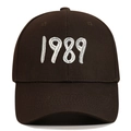 Detail of white 1989 embroidery on the dark brown twill cotton baseball cap - Coffee