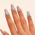 Silver nail rings set with sparkling zircons featuring four decorative crown shapes - Crown Hollow Nail Ring 4pcs Set (H06)