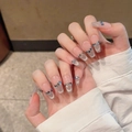 Detail of coffin-shaped press-on nails with silver cat-eye effect and blue rhinestones - Extra Small (XS) / Medium Coffin (2292)