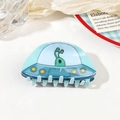 Detailed view of light blue acrylic UFO hair claw clip featuring a green alien character - 8.5cm UFO Hair Claw / Blue Cyan