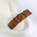 Brown pleated PU leather hair clip with a vintage cloud texture on a white tray - Wrinkled / Pleated Coffee
