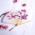 Bamboo folding fan with pink plum blossom patterns and golden silk tassel detail - White and Pink Plum Blossom Pattern Style (Women's Fan - 59)