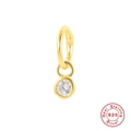Macro shot of 925 sterling silver gold earring with sparkling cubic zirconia pendant - Gold Single - Round Zircon
