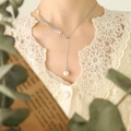 Elegant silver necklace featuring wheat leaf accents and a white pearl on a female model - Silver Pull-Clasp Style (2 Beads)