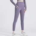 High-waisted pocket fitness leggings in currant purple with butt-lifting yoga design - Gallen Purple