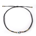 Bohemian black evil eye beaded bracelet with adjustable cord and gold-plated spacers - Black