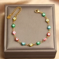 Detail of adjustable stainless steel evil eye bracelet with colorful enamel beads and lobster clasp - Colorful