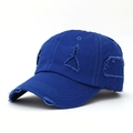 Close-up of distressed ripped details on a navy blue cotton canvas baseball cap - Sapphire Blue