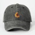 Detail of sunflower and butterfly embroidery on a vintage washed grey baseball cap - Black